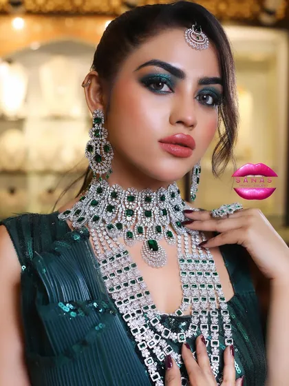 Another angle of the emerald jewellery look, showing the detail in the makeup and the sparkle of the stones.