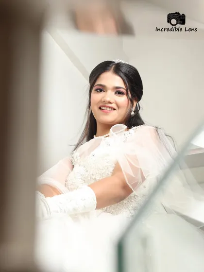 A candid shot from the Christian bridal shoot. Her smile is radiant, and the makeup looks fresh and natural.