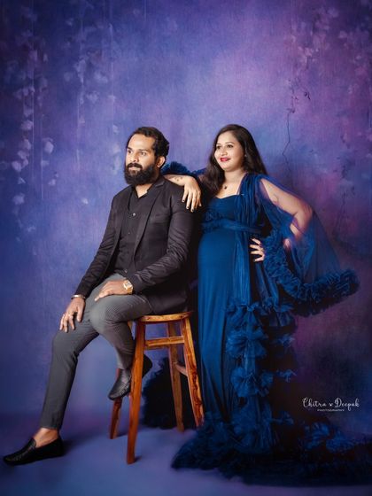 A cool and stylish pose. This couple exudes confidence and fashion in this modern maternity portrait.