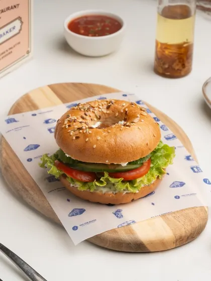 My Classic Bagel Sandwich is a simple yet perfect combination of a freshly baked bagel, cream cheese, and crisp vegetables like lettuce and tomato.