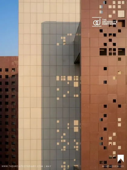 The facade of the Surat Diamond Bourse features a combination of solid stone panels and perforated 'jaali' screens. This detail illustrates our approach of blending modern materials with traditional techniques to achieve both aesthetic and functional goals, like sun shading and ventilation.