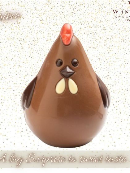 A fun, cartoonish chocolate chicken sculpture, with a round body and simple, cute features.