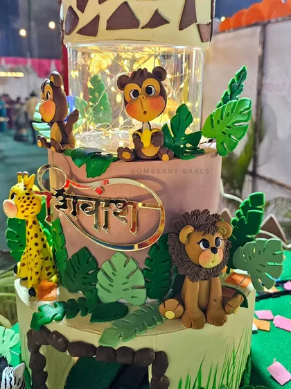 Another angle of the illuminated jungle cake with its handcrafted fondant animals.