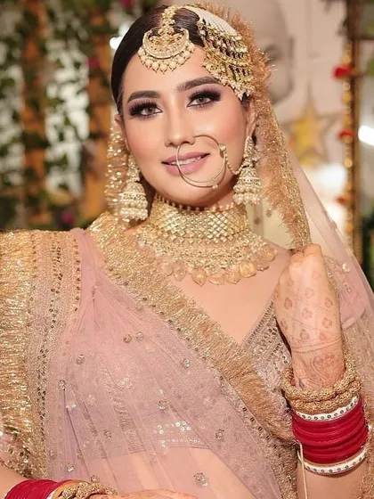 This bridal look captures the essence of elegance and timeless beauty. Book your appointment to get your own modern, regal look.