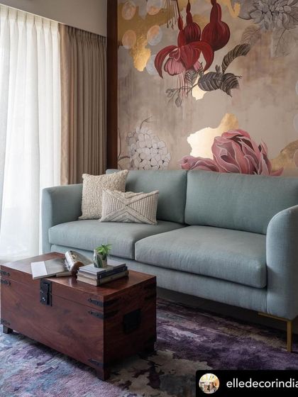 The mural as the centerpiece of the living room. Its blend of warm reds, soft pinks, and shimmering gold creates an atmosphere of grace and beauty.