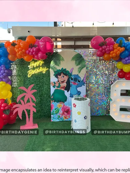 A vibrant, outdoor Lilo & Stitch party with a shimmer wall, neon sign, and a rainbow-colored balloon arch.