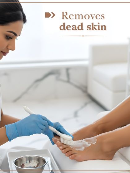 My pedicure service includes gentle but effective exfoliation to remove dead skin cells. Here, a technician is applying a treatment to reveal softer, smoother skin.