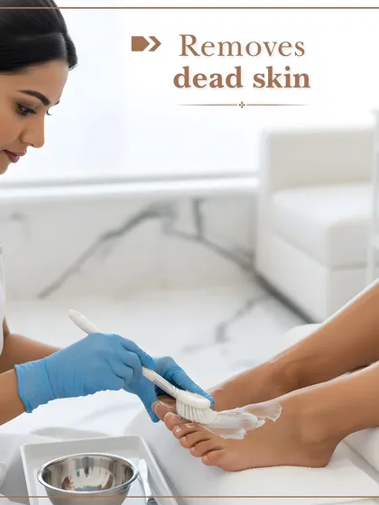 My pedicure service includes gentle but effective exfoliation to remove dead skin cells. Here, a technician is applying a treatment to reveal softer, smoother skin.