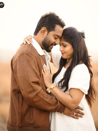 A duplicate of ID 11, this close-up shot beautifully captures the couple's tender connection against the warm glow of the setting sun.