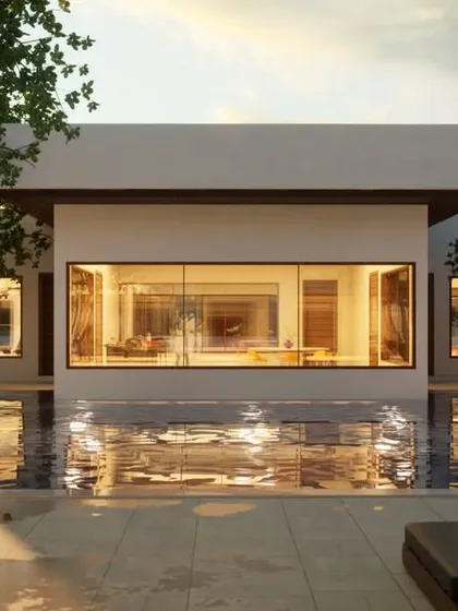 This design uses a shallow reflective pool at the front of the house to create a stunning visual effect. The water mirrors the architecture and sky, adding a layer of dynamic beauty to the entrance.