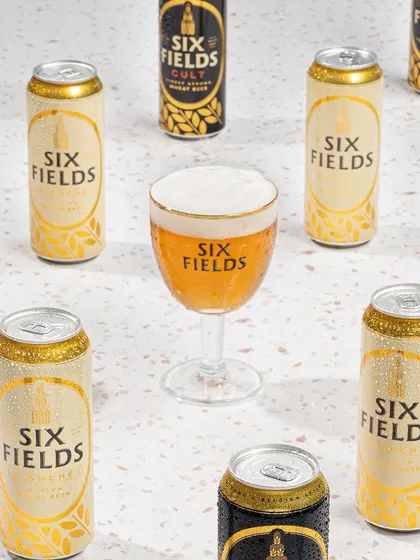 A bright and clean pattern shot for Six Fields, showcasing both their can designs in a way that is perfect for promotional materials and social media.