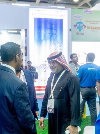 Engaging with international visitors at my ELECRAMA 2025 booth, showcasing my global reach.