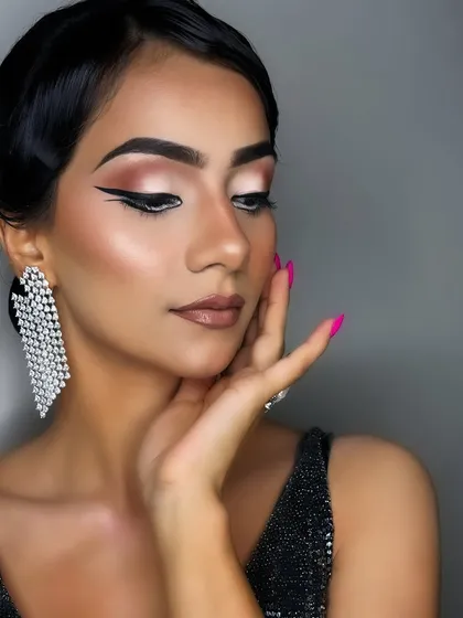 A softer moment from the same look, with eyes closed to showcase the perfectly blended neutral eyeshadow that forms the base for the dramatic liner.