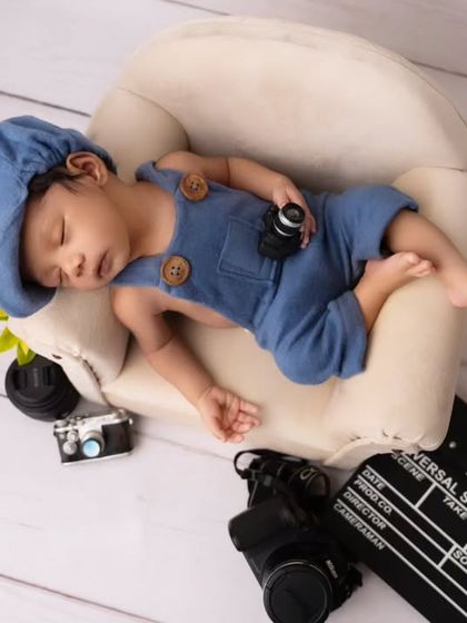 An aerial view of the little director, sleeping peacefully amidst the tools of the trade.