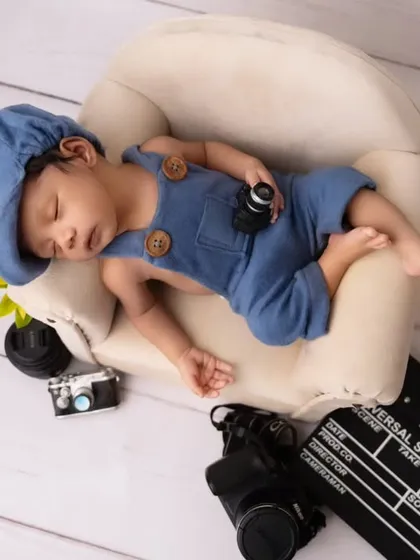 An aerial view of the little director, sleeping peacefully amidst the tools of the trade.