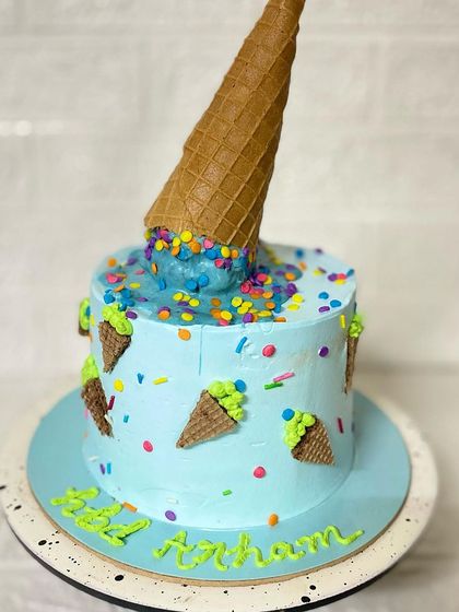 The vibrant colours and fun design of our melting ice cream cone cake.
