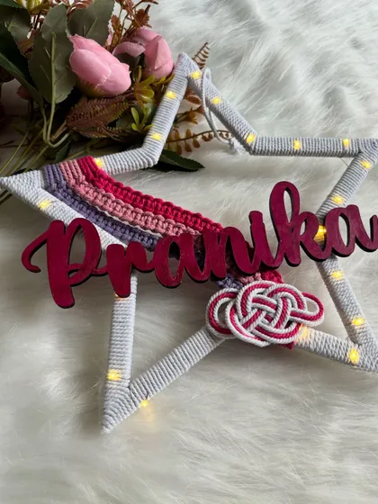 The 'Pranika' star hanging with fairy lights on, adding a celestial and dreamy feel to the design.