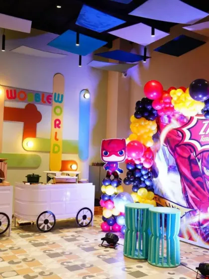 Our dining area is transformed for a superhero party, with a dynamic backdrop and themed food carts. We ensure the theme carries through every aspect of the event.