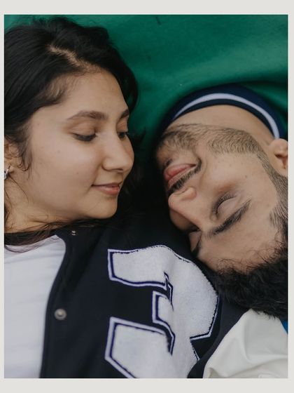 An intimate overhead shot of the couple resting on the basketball court. This quiet moment amidst a playful theme shows a different, more tender side of their connection.