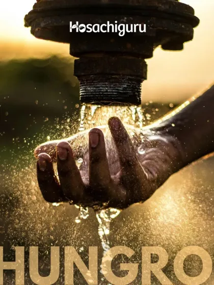 A hand holding a cup of water from a tap. Our water management ensures that every drop is used purposefully, providing clean, reliable water for all farm needs.