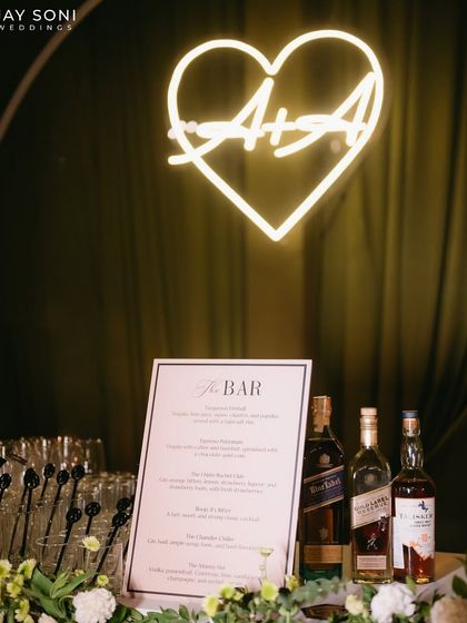 A close-up of the bar menu and the custom neon sign, showcasing the personalized details that make an event special.