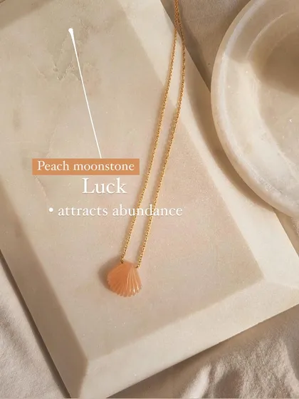 A closer look at the peach moonstone shell pendant. I chose this stone to bring luck and attract abundance, making it a powerful little charm.
