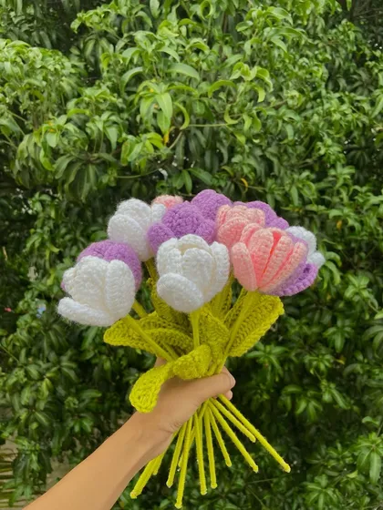 A lovely mixed bouquet of white, pink, and purple tulips.