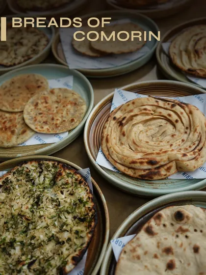 Round, flaky, crisp, or charred, our breads are crafted to be the perfect partner for any curry. This spread showcases the variety we offer, each one waiting to be torn, dipped, and devoured as you enjoy your meal.