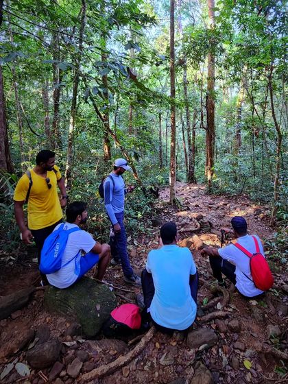 A group discussion during a break in the forest. Experienced trek leads are always there to guide and support you.