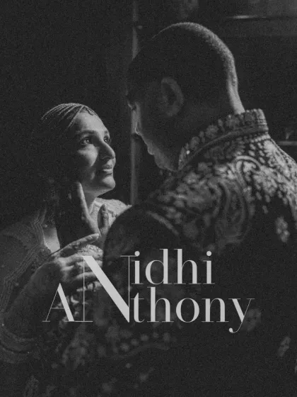 A moody and intimate black and white portrait from a Sangeet in Udaipur. The dramatic lighting highlights their close bond and the romance of the night.
