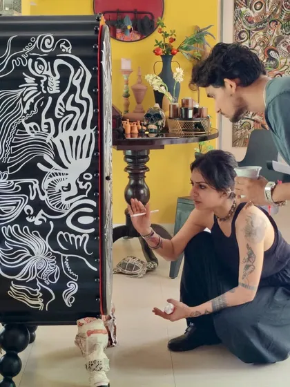 A look at our process, where ideas take physical form. Here, I am hand-painting the final details on a sculptural piece, working alongside my team to bring a client's story to life, one brushstroke at a time.