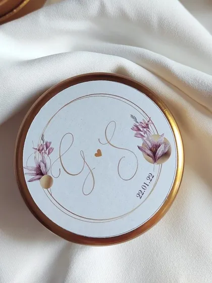 Our tin candles are a great hassle-free option for wedding favors. We designed this elegant label with the couple's initials for a modern and chic look.
