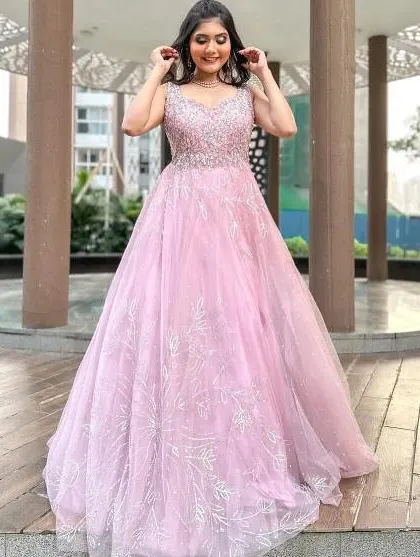 Feel like a princess in this beautiful pink ball gown, perfect for an engagement, pre-wedding shoot, or reception. The full tulle skirt and embellished bodice create a true fairytale look.