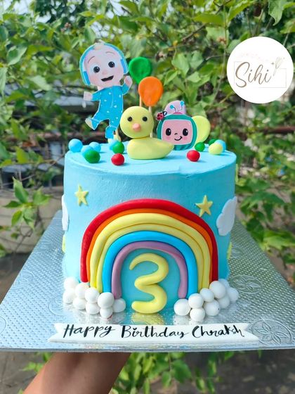 One of the most joyful cakes to make. This Cocomelon-themed cake is bursting with color, featuring JJ, a duck, a bright rainbow, and the number 3 for a happy birthday.