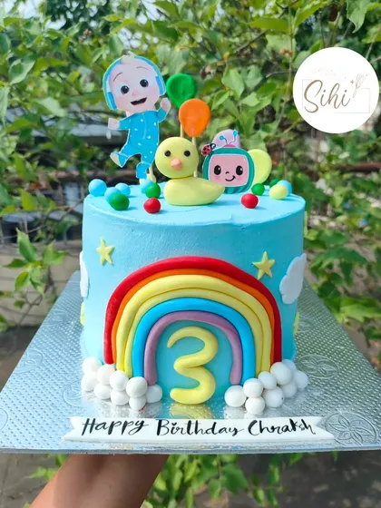 One of the most joyful cakes to make. This Cocomelon-themed cake is bursting with color, featuring JJ, a duck, a bright rainbow, and the number 3 for a happy birthday.