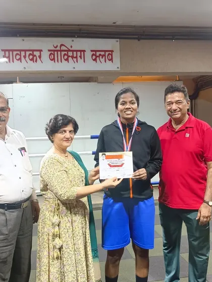 Another one of our gold medalists being awarded for her excellent performance in the ring.