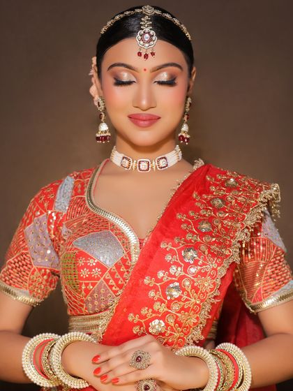 A serene shot of the completed bridal makeup. The focus is on flawless skin, expertly blended eyeshadow, and a look of pure elegance.