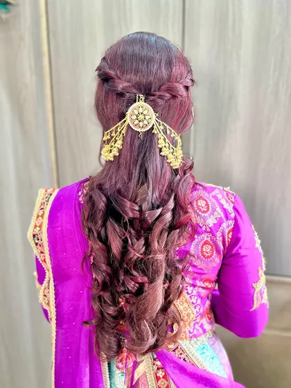 A look that turns heads. This bold, glossy, and unapologetically purple look is perfect for a bride who wants to stand out.