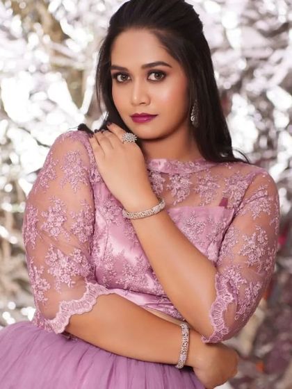 A model wearing a modern lavender gown, accessorized with our diamond-look bracelets and ring. I also offer individual pieces for rent.