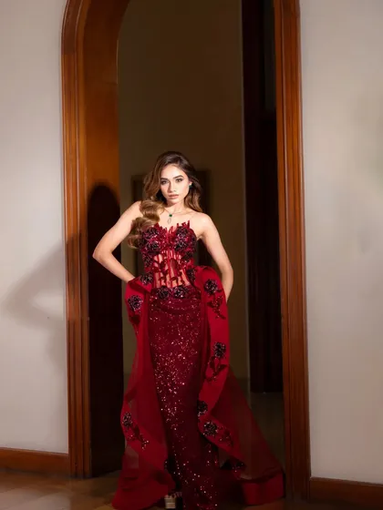 Presenting "Rose," a dramatic red couture gown. I styled this with a sheer corset bodice and floral appliqué for a look that is both romantic and daring.