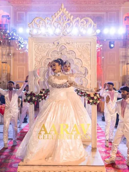 A unique anniversary entry where the couple enters on separate floats that join together. It symbolizes their journey and union, choreographed with dancers in elegant white gowns.