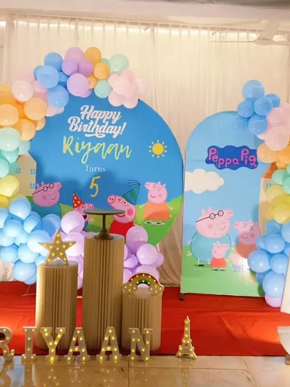 Another adorable Peppa Pig themed 5th birthday party, showcasing a similar design with a red carpet and different balloon colors.