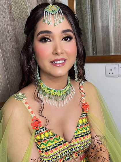 My prettiest bride Surbhi ready for her mehndi. The makeup was bright and fun to match her colorful Liz Paul outfit.