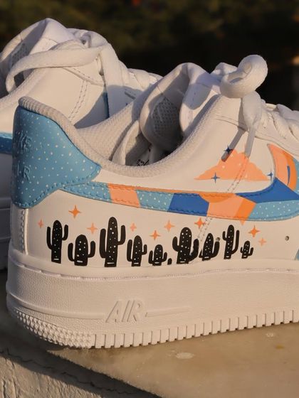 Another angle of the freehand pastel custom AF1s, showing how the different elements like the abstract swoosh and the cactus line come together.