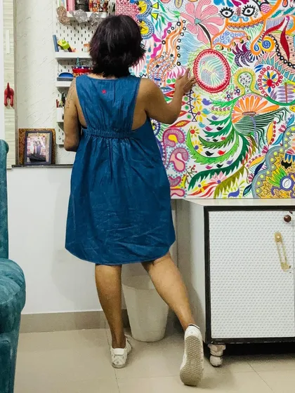 Pointing out a detail in my painting. Every section has a story.