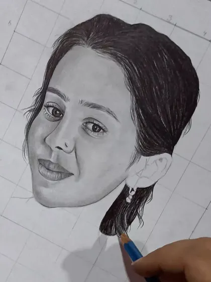 Here you can see my hand adding the final touches to the hair in the previous sketch, demonstrating the hands-on nature of my work.
