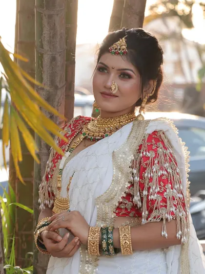 A sun-kissed shot of the bride, where the natural light enhances her glowing makeup. The soft focus on the eyes and the perfectly blended base create a dreamy, romantic feel.