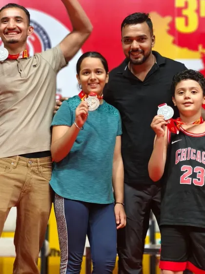 Our team is diverse, with champions of all ages. Here I am with some of our young female and male medal winners.