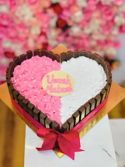 A popular choice for anniversaries and special moments. This heart-shaped cake is framed with KitKat bars and can be customized with your personal message.