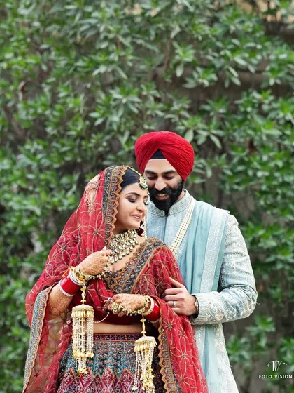 A quiet moment between Akanksha and Harshmeet. We focus on the rich colors and textures of traditional Sikh wedding attire, capturing the elegance and cultural significance of the day.
